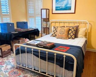 iron bed, Sailing print above bed signed by the artistRobert Taylor and Edward Heath ( Prime minister of the UK from 1970-1974)