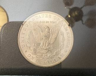 Item # 45 : Black Box Carson City Uncirculated Morgan Silver Dollar - 1884-CC $300.00
