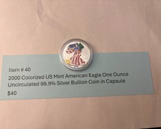 Item # 40 : 2000 Colorized US Mint American Eagle One Ounce Uncirculated 99.9% Silver Bullion Coin in Capsule $40.00