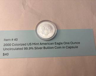 Item # 40 : (Reverse Side)2000 Colorized US Mint American Eagle One Ounce Uncirculated 99.9% Silver Bullion Coin in Capsule $40.00