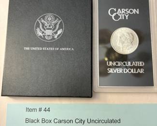 Item # 44 : Black Box Carson City Uncirculated Morgan Silver Dollar - 1883-CC $300.00