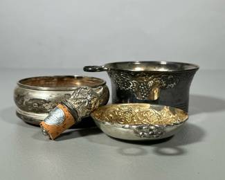 (4pc) SILVER PLATE WINE ITEMS | Including: silver plate tastevin, potentially Sterling silver & wood bottle coaster, silver plate bottle coaster, and bottle stopper - h. 2 x dia. 4.25 in (largest)