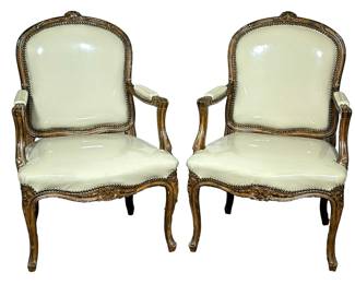 (2pc) PAIR OF LOUIS XVI STYLE ARMCHAIRS | Lewis Mittman Inc Louis XVI style armchairs having carved floral top over riveted back & seat with carved cabriole legs - h. 38.6 x w. 26 x d. 20 in