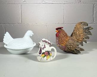 (3pc) Chickens | Small chicken pitcher, white covered chicken dish and decorative light rooster made out of wood scrapes and perhaps paper mache.
Dimensions: h. 5.5 x w. 6 x l. 7.5 in (white covered dish)