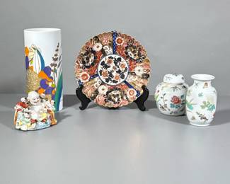 (5pc) Buddha, Plate, And Vases | Laughing Buddha porcelain figurine, oriental style gold and rust plate, Rosenthal signed vase, two smaller Chinese pieces.
Dimensions: h. 9.5 x w. 5 in