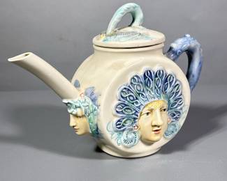 Unique Pitcher | Woman with blue handle and blue headwear. Marked on the bottom. - h. 7 x w. 9 in