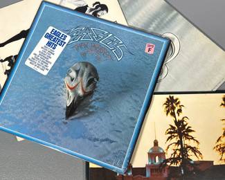 (4pc) Eagles And Chicago Vinyl | Including Chicago KGP24 with original poster Rumours Bsk3010 with insert Hotel California 6e-103 Greatest hits 7e 1052-B with shrink wrap.