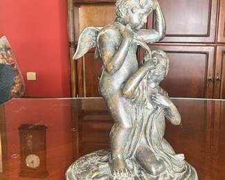 bronze sculpture of two cherubs.