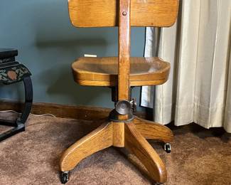 Antique oak banker's chair, early 20th Century