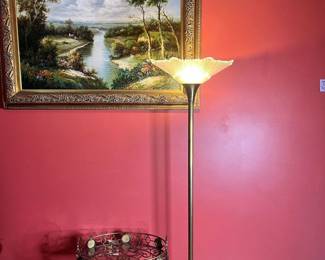 A vintage torchiere floor lamp