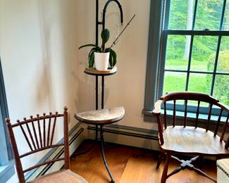 Wrought iron plant stand, bamboo and rattan dining chair, and a captain's chair