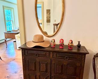 Painted African ebony cabinet and gilt mirror