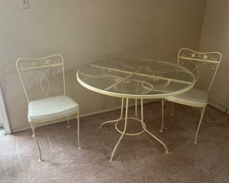 Cream wrought iron table with 4 chairs