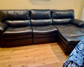 Black leather couch with reclining zero clearance