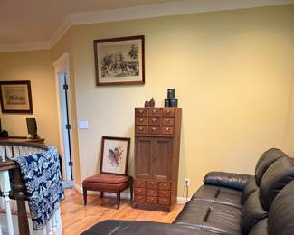 Coverlet. Leather couch, card catalogue