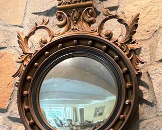 Early carved wooden convex mirror