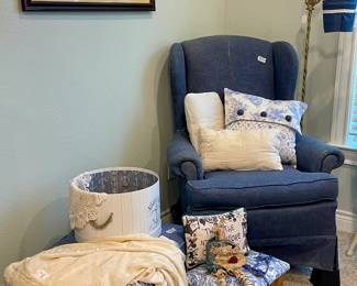 Brass Floor Lamp and Blue Cushioned Chair with Ottoman