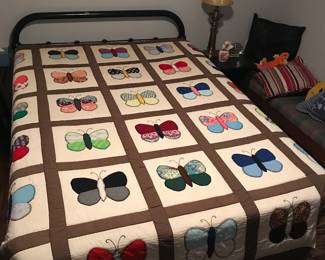 Full black metal bed set
Beautiful handmade butterfly quilt