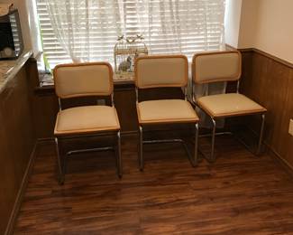 Three metal/vinyl chairs.