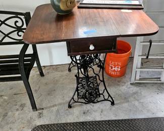 Drop leaf table with sewing base.