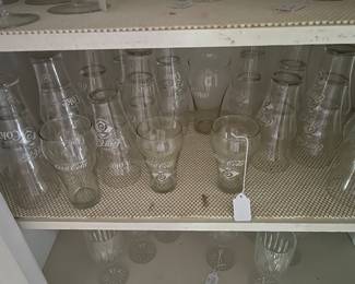 Lots of tumblers of all sizes - these are mostly with a Coca Cola emblem and date to its 75th anniversary