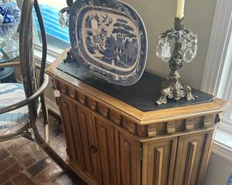 Yet another credenza with a black stone inset top. Serving dish is antique Blue Willow