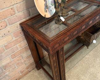 Sofa table with a decided Asian motif - hand painted chargers and Asian bronzes