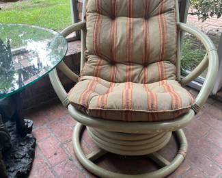 One of a pair of rattan chairs