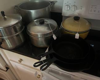 Vintage cast iron along with a quantity of other vintage cookware