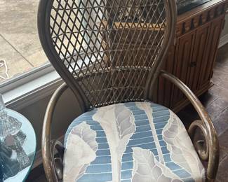 One of a pair of rattan chairs