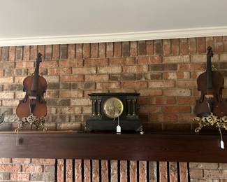 Vintage violins and a late 19th Century mantle clock