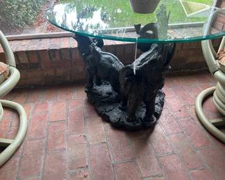 Glass topped low side table with an elephant motif (surprise!)
