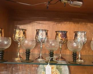 Kirk silver plated goblets in rear and German-style glass goblets in front
