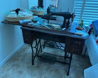 White treadle sewing machine, lots of packages of lace & trim,