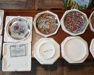 Decorative plates in their original packaging.