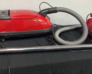 2 Red Vacuum Cleaners