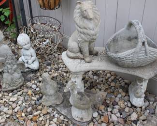 Various concrete angels, geese, bench