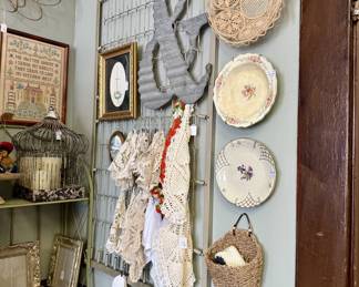 Hanging plates, doilies, bird cages and other wall decor.