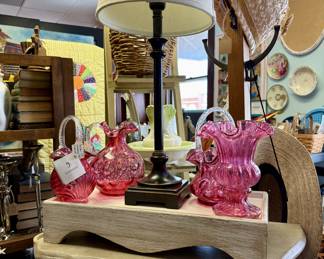 Beautiful pink glassware, tables, lamps.
