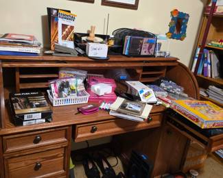 Roll top desk with office supplies, designer mens shoes, books, games etc.