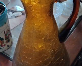 Amber glass pitcher is stunning it’s a pilgrim crackle glass amber in color antique