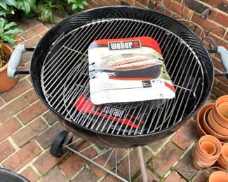 #92 Weber Charcoal Grill w/new Racks on wheels $75.00