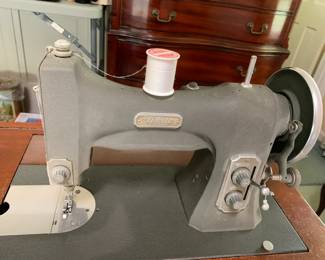 #57 White Sewing Machine in Cabinet $50.00