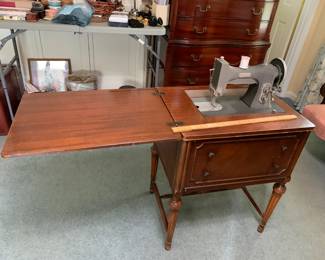 #57 White Sewing Machine in Cabinet $50.00