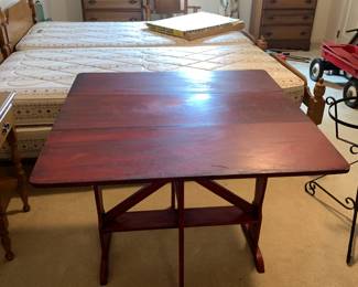 #18 red painted gate leg table 11-35x25x29 $65.00