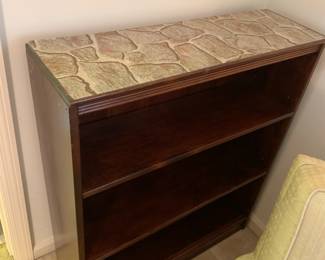 #125 Wood 2 shelf Bookcase - 30x9.5x35 $40.00
the stone paper was taken off and it is plain wood top