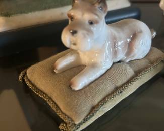Cute small pup on a pillow figurine.