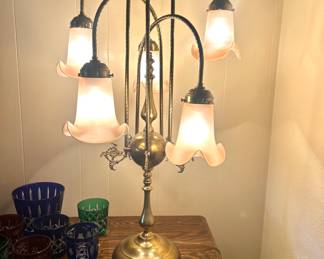 Super swanky vintage upside down tulip frosted glass flower lamp with brass base. There is also a floor lamp that matches.