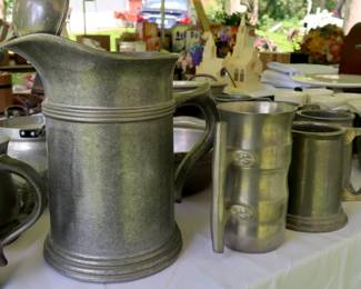 Pewter serving pitcher and other pewter items.