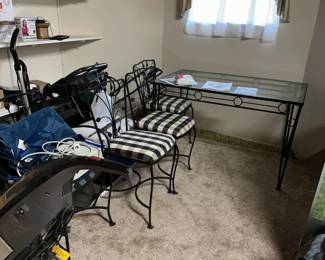 wrough iron table and 4 chairs